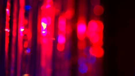 Defocused-Close-Up-Shot-Of-Sparkling-Tinsel-Curtain-In-Night-Club-Or-Disco-With-Flashing-Strobe-Lighting-4